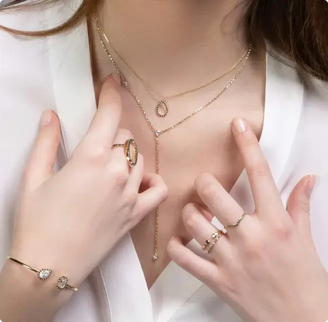 Model wearing necklaces